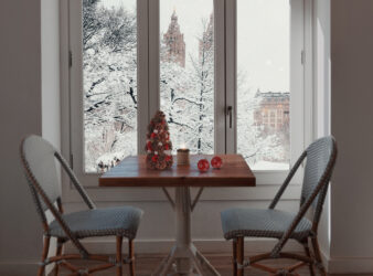Home snowy window with christmas inte