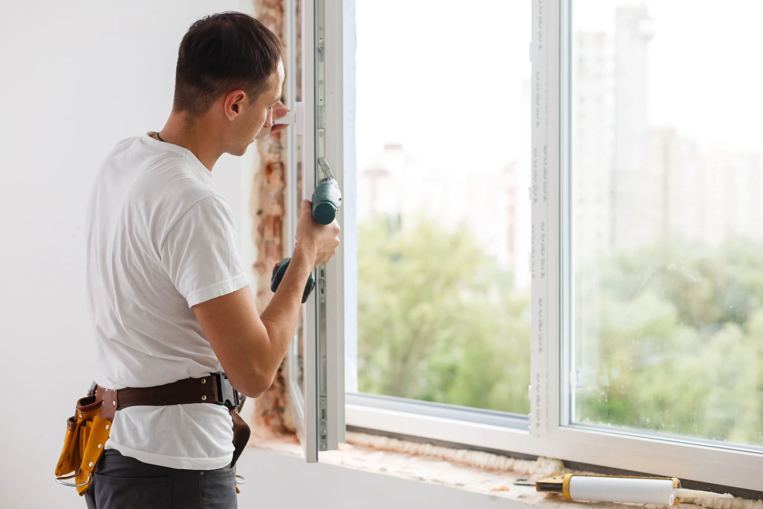 Sliding Windows young handyman repair window wit