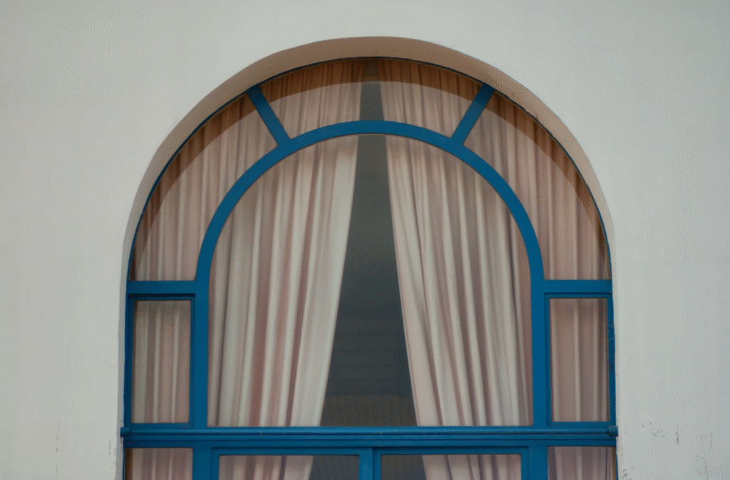 Expert Window & Door Replacement in Arlington Heights, IL: Why It Matters arched window with blue frame